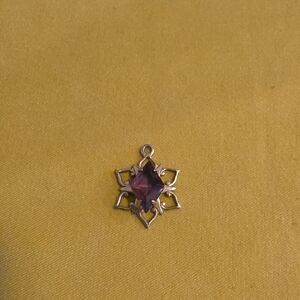 Vintage pendant featuring a central faceted purple gemstone (poss. amethyst)